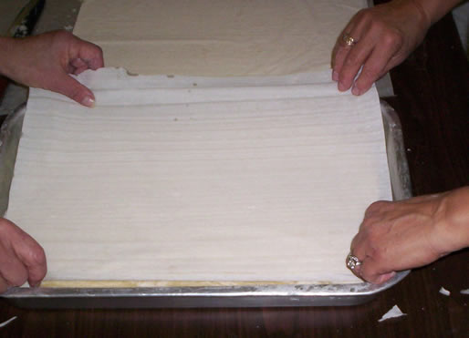 Layering filo dough in a pan